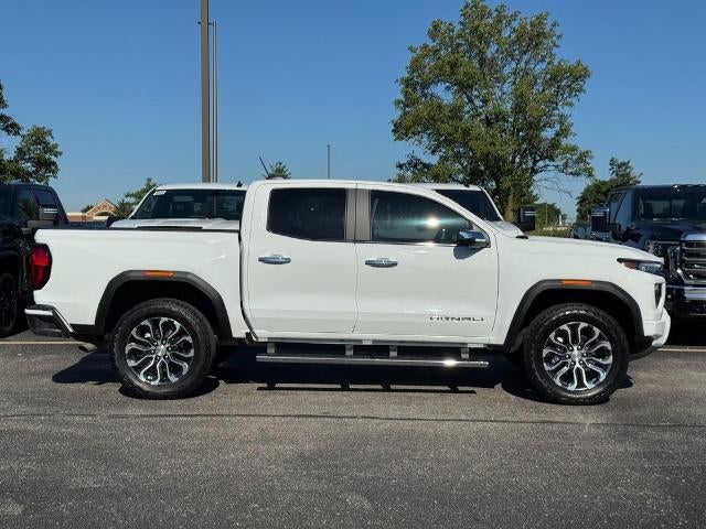 2025 GMC Canyon Denali in Summit White — front three-quarter view