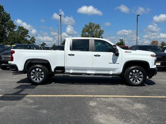 2024 Chevrolet Silverado 2500 HD Custom in Summit White — front three-quarter view